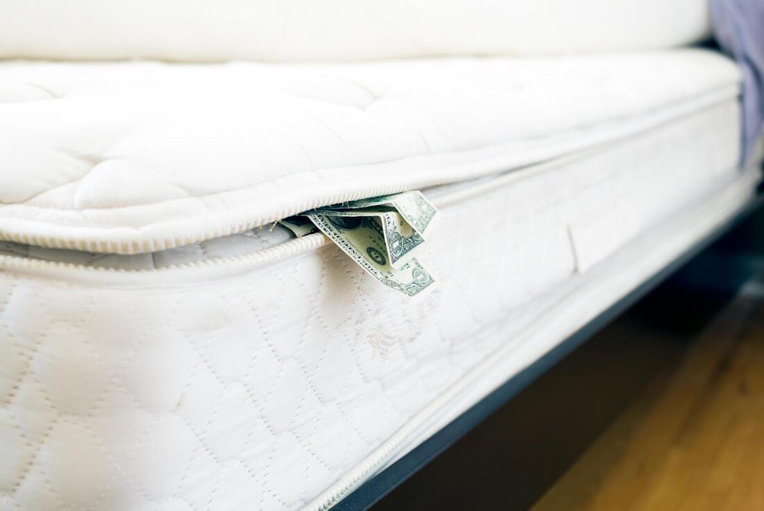 a white mattress with dollar